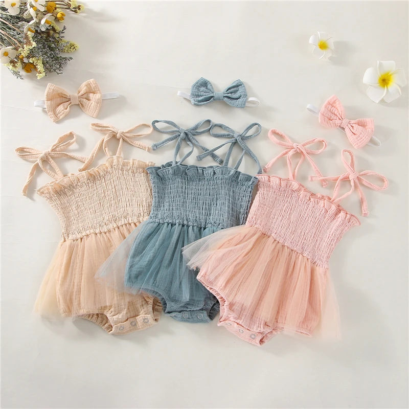 Peach, Pink and Blue  Infant Blue bodysuit with ties at the shoulder, snap bottom and a tulle skirt.