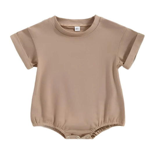 beige Tshirt bodysuit with elastic legs and a snap bottom.