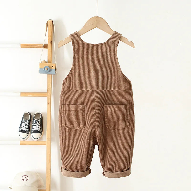 Baby and toddler brown corderoy pnts with roll up pant cuffs, 2 back pockets and adjustable straps.