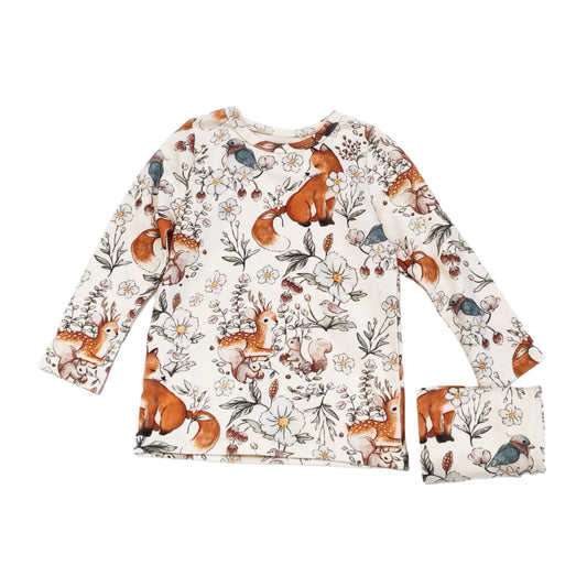 Cotton pajamas for children one to six years old with very cute squirrels and graphics in cream and orange.