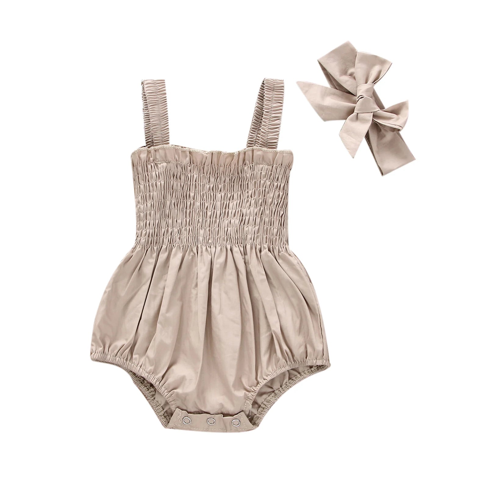 Beige infant romper with elastic straps at the shoulder a snap bottom and an elastic top with a bow.