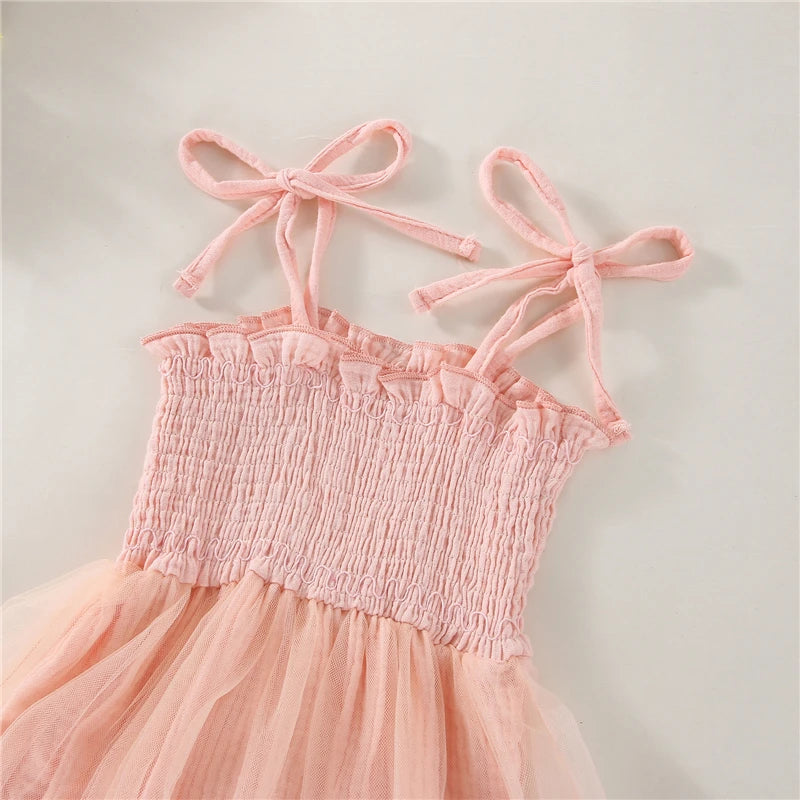 Pink Infant Blue bodysuit with ties at the shoulder, snap bottom and a tulle skirt.