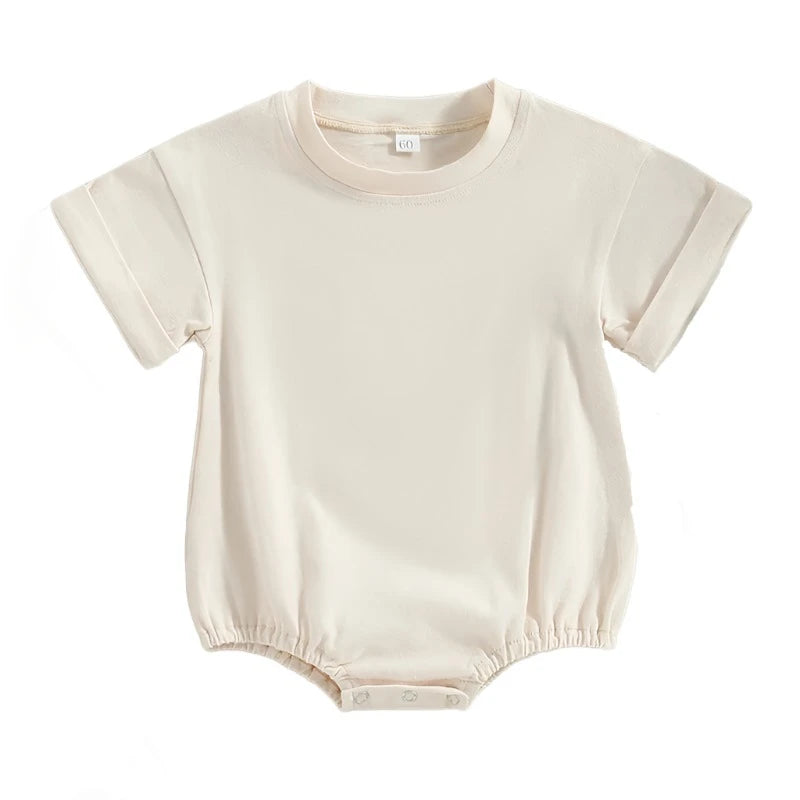 White Tshirt bodysuit with elastic legs and a snap bottom.