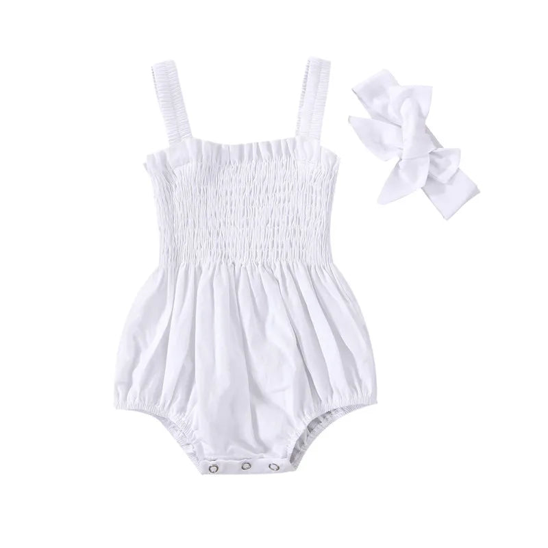 White infant romper with elastic straps at the shoulder a snap bottom and an elastic top with a bow.