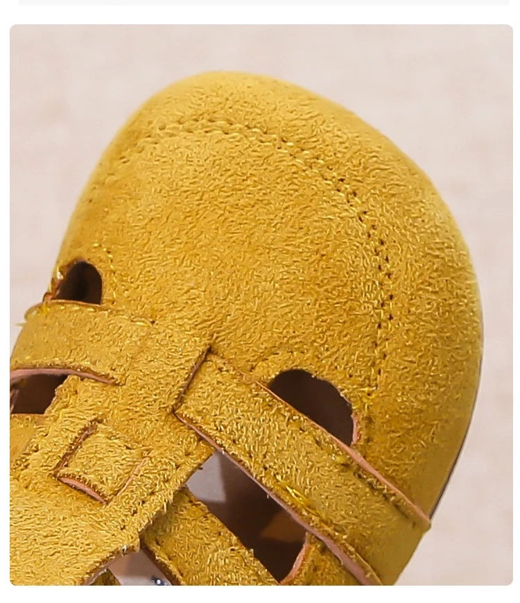 Barefoot wide sandles for kids in yellow in a roman style with a velcrow strap