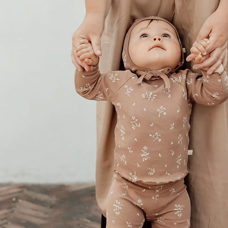 baby wearing cute beige  infant sleeper