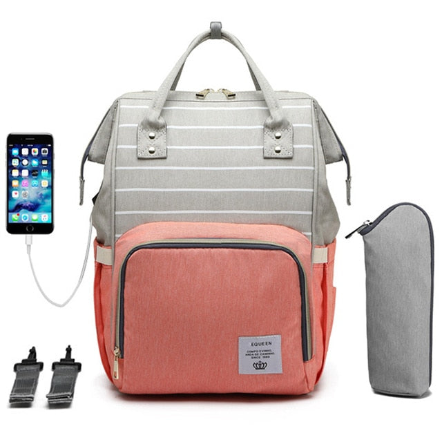 Pink stripe diaper bag and backpack with an insulated waterbottle pouch, a USB charger for your phone and multiple pockets.