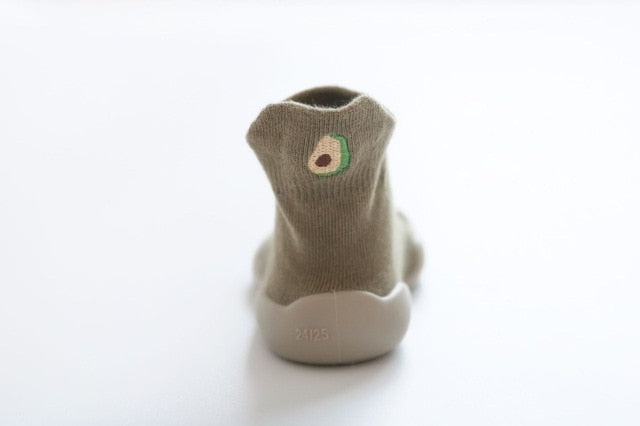 The heal view of the Green Avocado shoe with the avocado icon