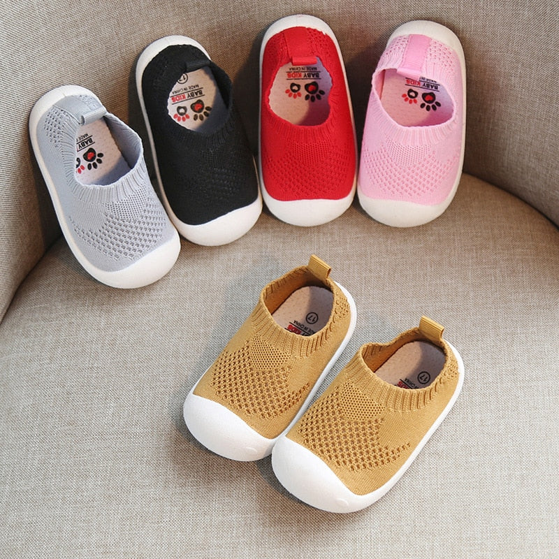 Soft top ankle sock shoes with a rubber bottom in 5 colors.