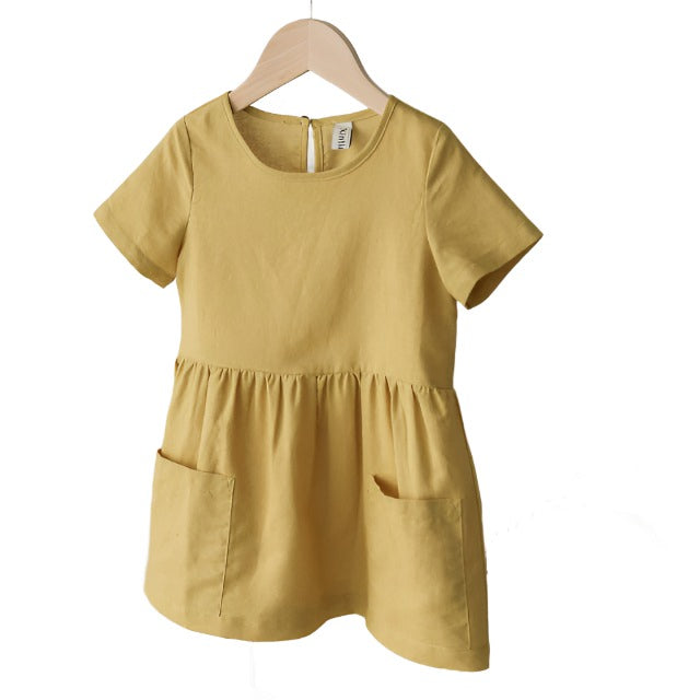 Yelloe short sleeved girls linen dress with front pockets.
