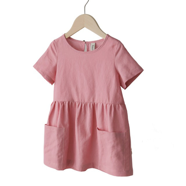 Pink short sleeved girls linen dress with front pockets.