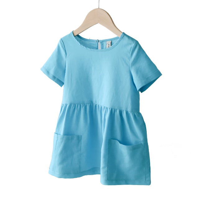 Light Blue short sleeved girls linen dress with front pockets.