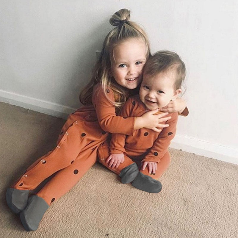kids wearing rust matching sleeoers