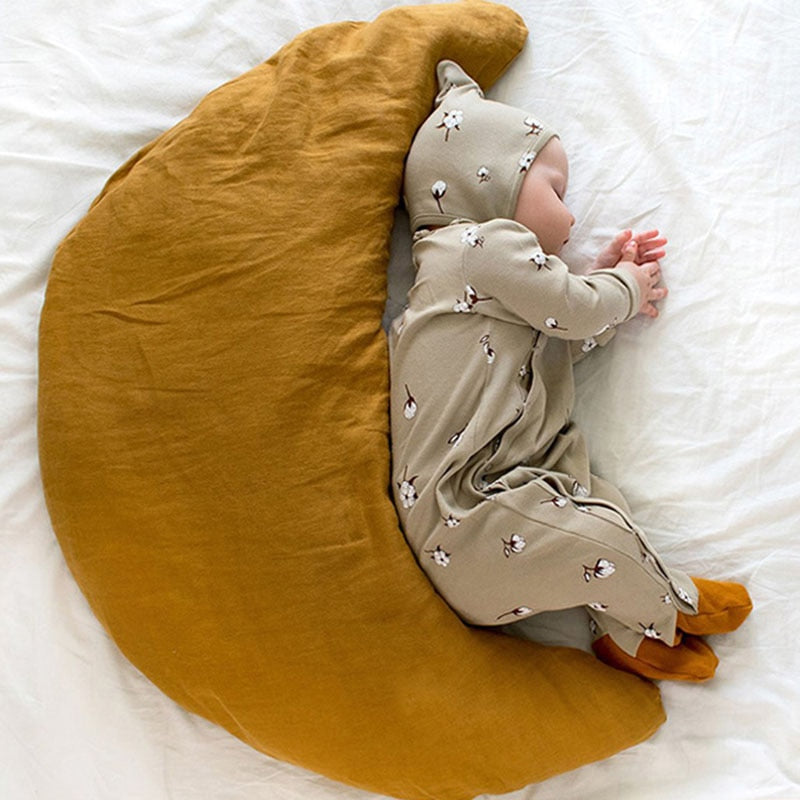 beige Infant sleeper with matching hat, with a flower graphic