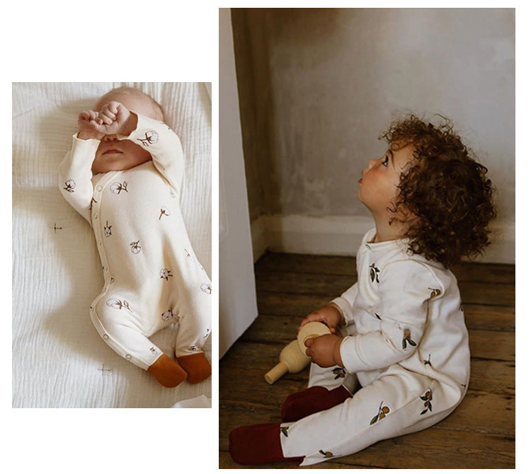 a baby and a toddler wearing Ivory Infant sleeper with matching hat, with a flower graphic