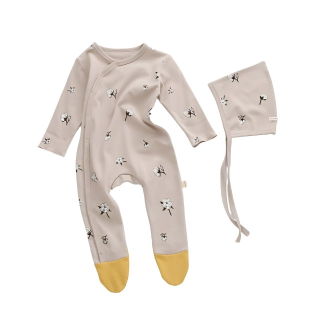 Beige Infant sleeper with matching hat, with a flower graphic