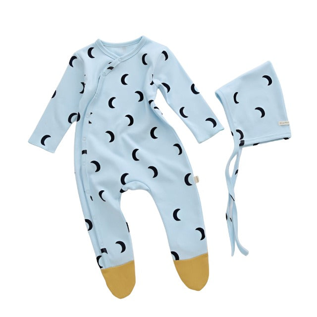 blue Infant sleeper with matching hat, with a black moon graphic and yellow feet