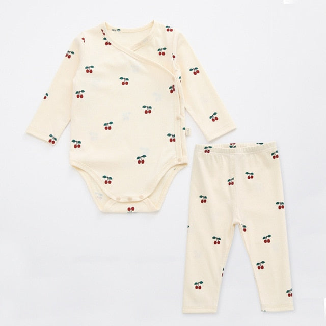 2 Piece set, long sleeved onesie with side and bottom snaps and leggings with cranberries
