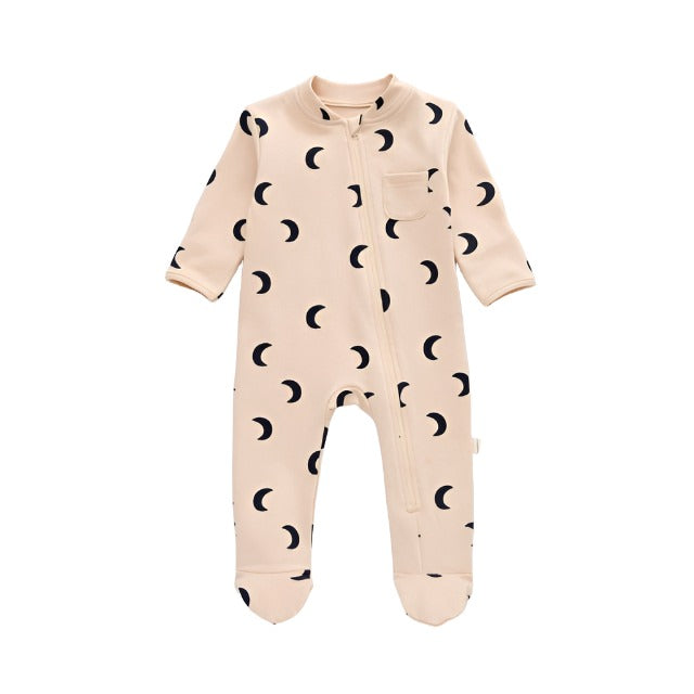 Graphic baby sleeper, peach, with black half moonsNewborn sleeper with fold over cuffs that is beige with dark blue moons graphics