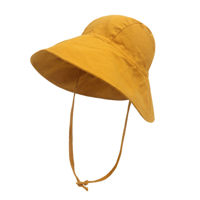 Wide brimmed yellow summer baby hat