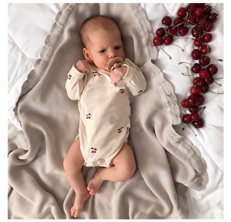 Newborn wearing 2 Piece set, long sleeved onesie with side and bot2 Piece set, long sleeved onesie with side and bottom snaps with cherrie graphics