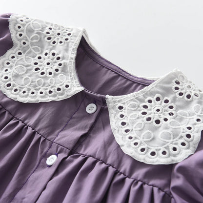Super cute lace collar  on the back of a purple dress for toddlers and girls. 