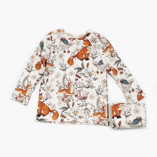 Cotton pajamas for children one to six years old with very cute squirrels and graphics in cream and orange.