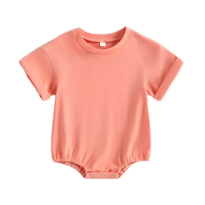 Orangy pink Tshirt bodysuit with elastic legs and a snap bottom. 