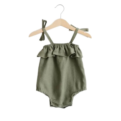 Green toddler romper that grows with your baby. Ties shoulders, snap bottom, ruffles at the neckline