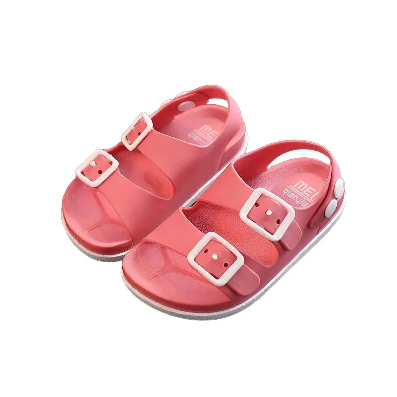 Pink waterproof kids sandals with two straps on the top with buckles and a strap on the heal with snaps. 