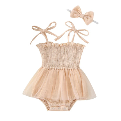 Cream Infant Blue bodysuit with ties at the shoulder, snap bottom and a tulle skirt. 