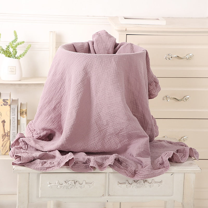 light purple, organic cotton recieving blanket with ruffles in the edge. 