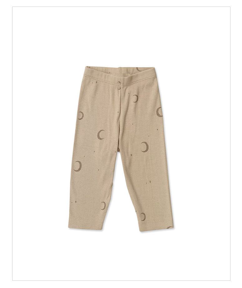 Light beige baby and toddler pants with brown half moon graphics