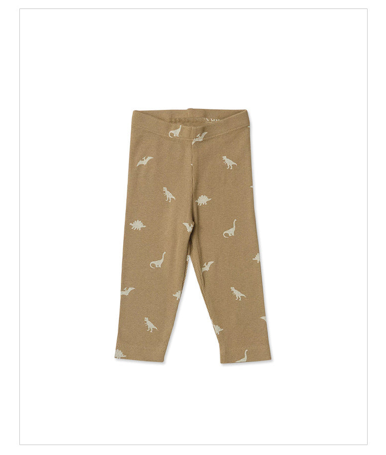 beige baby pants with small dinosaur graphics in ivory