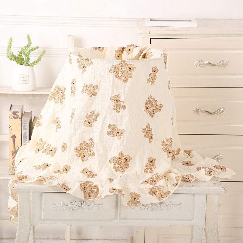 organic cotton recieving blanket with ruffles in the edge. with teddy bears