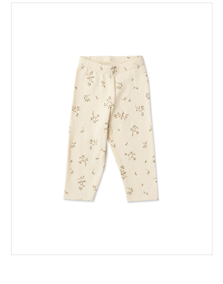 ivory baby and toddler pants with brown small flower graphics