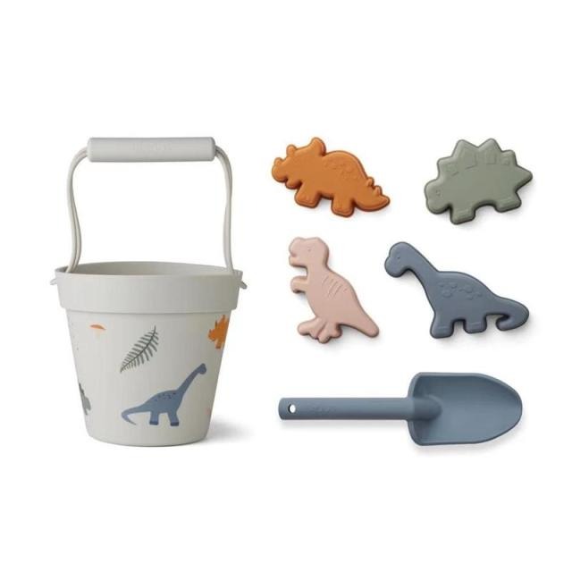 6 piece silicone sand toy set in mint with 4 dinosaur molds and a shovel