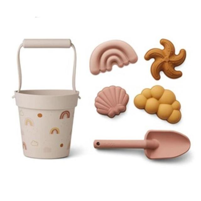 6 piece silicone sand toy set in beige with 4 seashell molds and a shovel