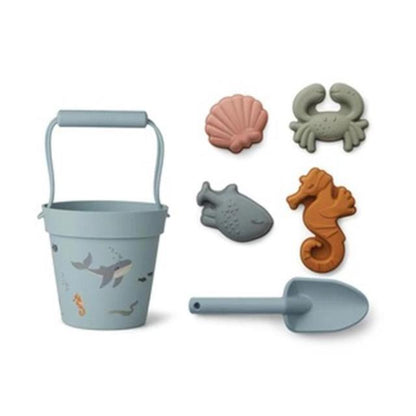 6 piece silicone sand toy set in blue with 4 sea animal molds and a shovel