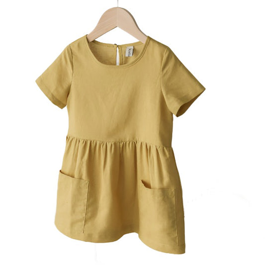 Yelloe short sleeved girls linen dress with front pockets. 