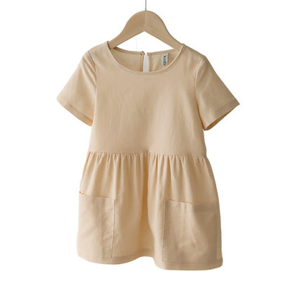 Cream short sleeved girls linen dress with front pockets. 