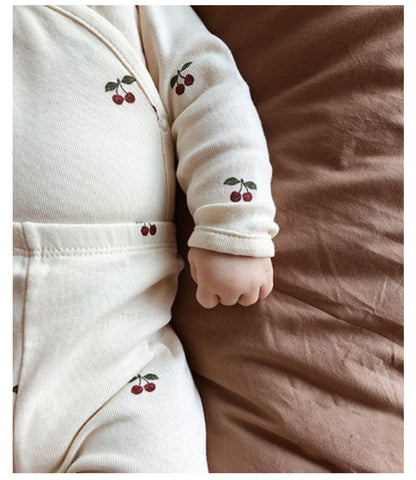 2 Piece set, long sleeved onesie with side and bottom snaps and leggings with cherry pattern