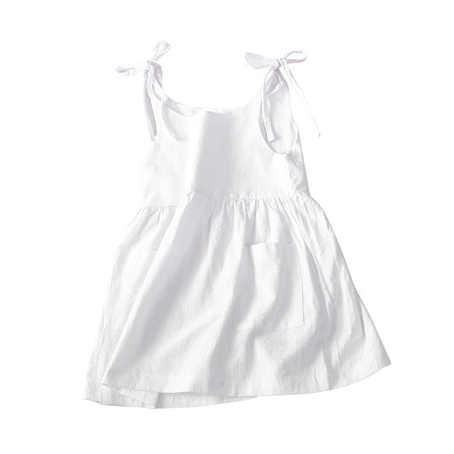 summer baby dress with ties at the shoulder, ruffled skirt, and front pockets in white